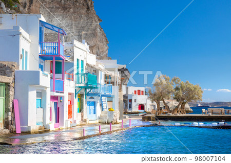 Vibrant fishing village of Klima with white houses and colorful doors on Milos Island in Greece Vibrant fishing village of Klima with white houses and colorful doors on Milos Island in Greece 98007104