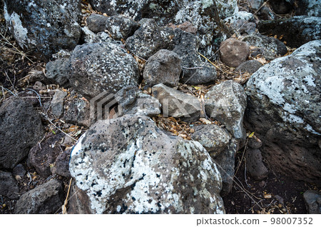 Closeup of large rocks or boulders near the mountains. Large multicolored granites. Details of big grey stone structures with orange particles shining in the sunlight. Closeup of large rocks or boulders near the mountains. Large multicolored granites. Details of big grey stone structures with orange particles shining in the sunlight. 98007352