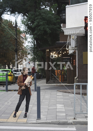 beautiful girl with baguettes and coffee beautiful girl with baguettes and coffee 98007959