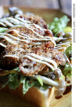 Open sandwich with minced meat cutlet and vegetables on bread Open sandwich with minced meat cutlet and vegetables on bread 98008646