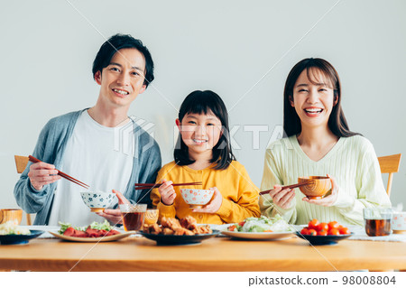A young family eating A young family eating 98008804