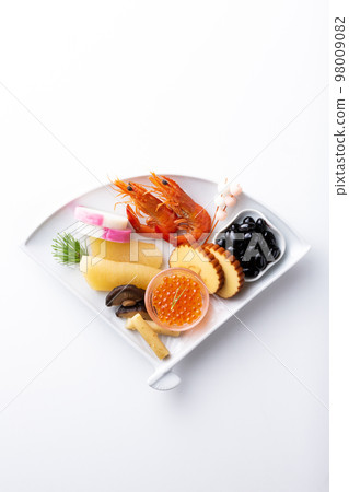 New Year dishes served on a fan-shaped plate 98009082