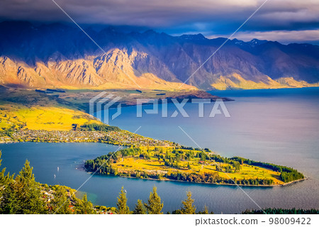 Above Queenstown and Lake Wakatipu in south Island, New Zealand at sunset Above Queenstown and Lake Wakatipu in south Island, New Zealand at sunset 98009422