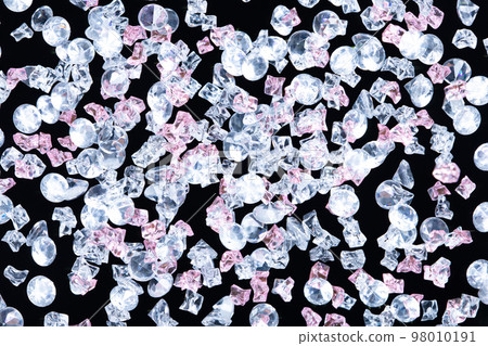 Sparkling Gemstone Diamond and plastic rock fly floating in mid air. Many group gem Diamonds shape as crystal luxury jewel fall as wealth money. Black background isolated Sparkling Gemstone Diamond and plastic rock fly floating in mid air. Many group gem Diamonds shape as crystal luxury jewel fall as wealth money. Black background isolated 98010191