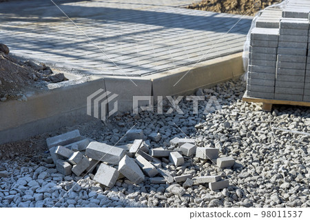 Preparation for laying gray concrete bricks pavers well as pavement sidewalk constructions landscaping pavers to be laid Preparation for laying gray concrete bricks pavers well as pavement sidewalk constructions landscaping pavers to be laid 98011537