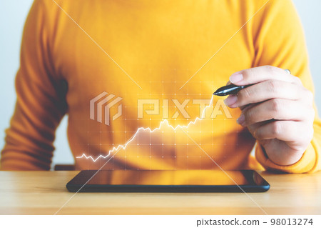 Businessman pointing arrow graph corporate future growth plan 98013274