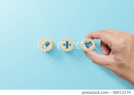 Hand arranging wood block with icon healthcare medical, Insurance for your health concept 98013276