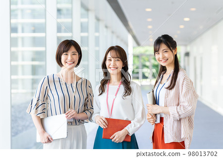 Young female staff working in the office Young female staff working in the office 98013702