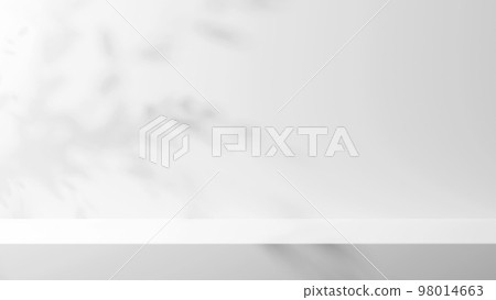 A white pedestal on a luxurious white background. Shadows of leaves. Pedestal for products, cosmetics. (Landscape) 98014663