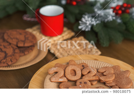 Merry Christmas and New Year. Gingerbread 2023 in kitchen close-up 98018075