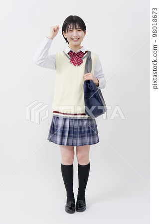 High school girl doing a guts pose, whole body, white background 98018673