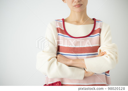 An image of a housewife or nursery teacher thinking with a troubled face No face 98020128