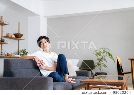 Young man relaxing in the room 98020264