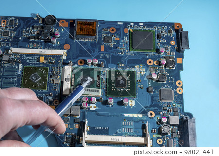 replacement of thermal paste in the cooling system on the laptop computer board replacement of thermal paste in the cooling system on the laptop computer board 98021441