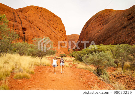 Two women visiting Kata Tjuta (Mount Olga) Two women visiting Kata Tjuta (Mount Olga) 98023239