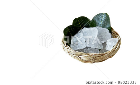 Crystal clear alum cubes or Potassium alum in small weaved basket chemical compound substance concept for beauty spa and underarm treatment industrial 98023335