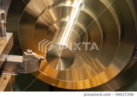 Closeup scene the lathe machine finish cut the brass parts by lathe tools. Closeup scene the lathe machine finish cut the brass parts by lathe tools. 98023396