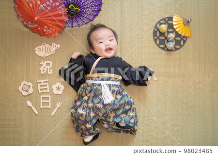 Celebrating the 100th day in Japanese clothes in a hakama 100-day-old baby eating first meal 98023485
