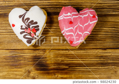 Heart shaped cookies on wooden table. Top view, copy space. Dessert for valentine day 98024230