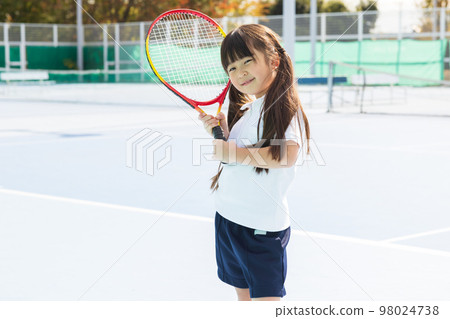 kid playing tennis kid playing tennis 98024738