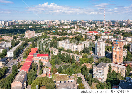 Aerial photography, landscape of the summer city of Kyiv immersed in greenery and sunlight. Aerial photography, landscape of the summer city of Kyiv immersed in greenery and sunlight. 98024959