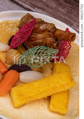 Lamb smil pie served with fried polenta, carrot, turnip, mushroom and sauce Lamb smil pie served with fried polenta, carrot, turnip, mushroom and sauce 98025702