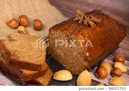 Traditional spice gingerbread cake with honey, ginger, cinnamon, nutmeg Traditional spice gingerbread cake with honey, ginger, cinnamon, nutmeg 98025703