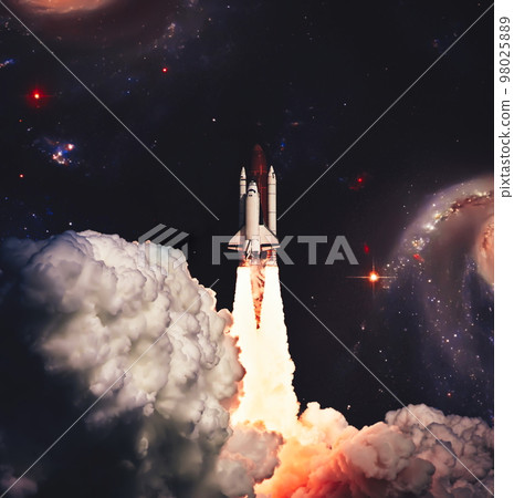 Shuttle launch in the clouds to outer space. Dark space with stars on background.Spaceship flight. Elements of this image furnished by NASA Shuttle launch in the clouds to outer space. Dark space with stars on background.Spaceship flight. Elements of this image furnished by NASA 98025889