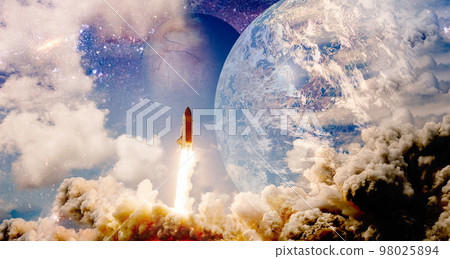 Shuttle launch in the clouds to outer space. Dark space with stars on background.Spaceship flight. Elements of this image furnished by NASA 98025894