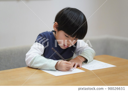 boy practicing calligraphy boy practicing calligraphy 98026631
