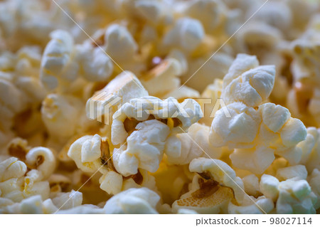Pile of popcorn closeup macro shot, selective focus, texture background Pile of popcorn closeup macro shot, selective focus, texture background 98027114