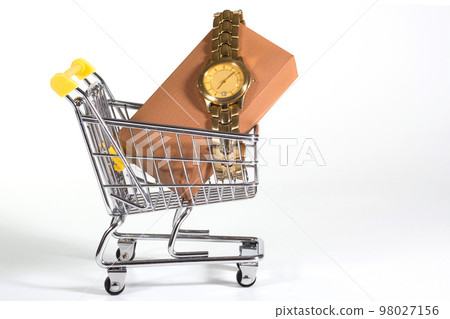 A golden watch in a shopping cart at the white background. Presents, purchases A golden watch in a shopping cart at the white background. Presents, purchases 98027156