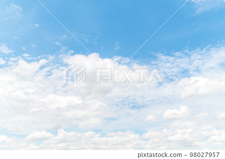 Beautiful white fluffy clouds in blue sky. Nature background from white clouds in sunny day Beautiful white fluffy clouds in blue sky. Nature background from white clouds in sunny day 98027957
