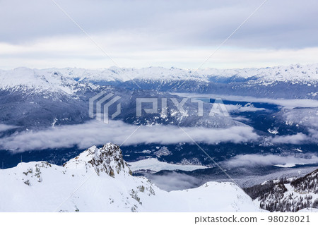 Canadian Mountain Landscape Nature Background covered in snow. Whistler 98028021