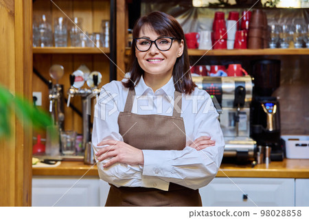 Portrait of middle aged confident woman restaurant owner Portrait of middle aged confident woman restaurant owner 98028858