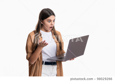 amazed blogging girl with pc for communication in studio. communication of blogging girl. 98029266