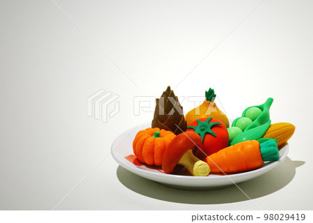 Food model still life with colorful vegetables on a plate Food model still life with colorful vegetables on a plate 98029419