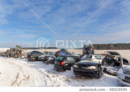 Disassembled cars on a car dump are on sale for spare parts. Disassembled cars on a car dump are on sale for spare parts. 98029999
