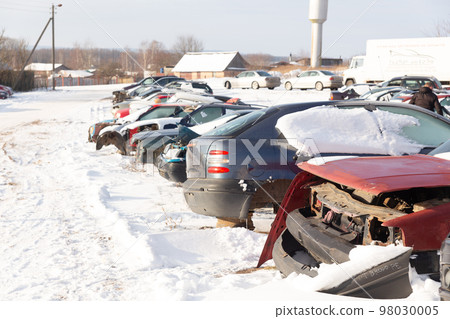 Disassembled cars on a car dump are on sale for spare parts. Disassembled cars on a car dump are on sale for spare parts. 98030005
