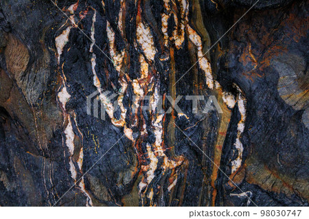 Rocky shapes on the beach. textures and patterns generated on the stones of the Asturian beaches Rocky shapes on the beach. textures and patterns generated on the stones of the Asturian beaches 98030747