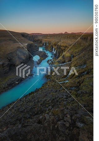 Beautiful waterfall with turquoise water in Iceland Beautiful waterfall with turquoise water in Iceland 98030760