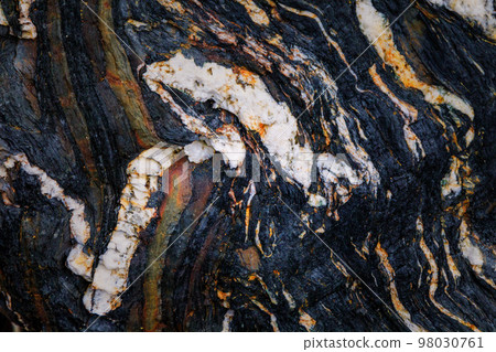 Rocky shapes on the beach. textures and patterns generated on the stones of the Asturian beaches 98030761