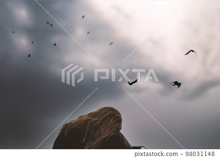 girl teenager student lonely upset by the sky with birds thinks about a difficult life tragedy. High quality photo 98031148