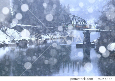 Tadami Line in winter with snow 98035872