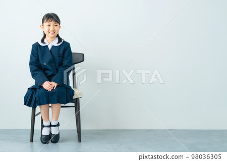 smiling girl in uniform 98036305