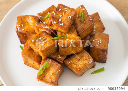 fried tofu with white sesame and teriyaki sauce fried tofu with white sesame and teriyaki sauce 98037994