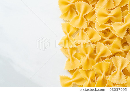 Dry uncooked farfalle pasta Dry uncooked farfalle pasta 98037995