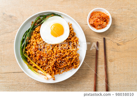 dried Korean spicy instant noodles with fried egg dried Korean spicy instant noodles with fried egg 98038010