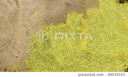 Chemical toxic waste from factory industry. Yellow sulphur powder. Hazardous waste. Acid toxic waste in factory concept. Toxic waste pollution. Soil contamination or soil pollution. Environment issue. 98038103
