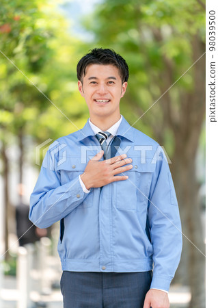 Business image A man in work clothes 98039500